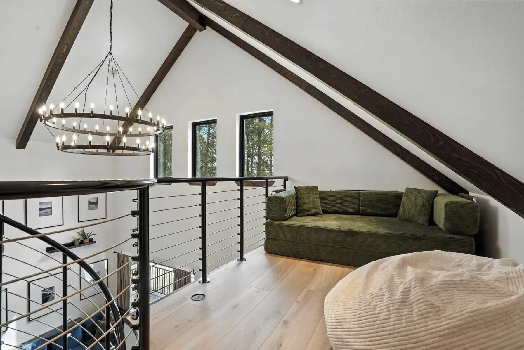 A finished vaulted loft on an iLevel build — the bar we hold on long sightlines and exposed beams.